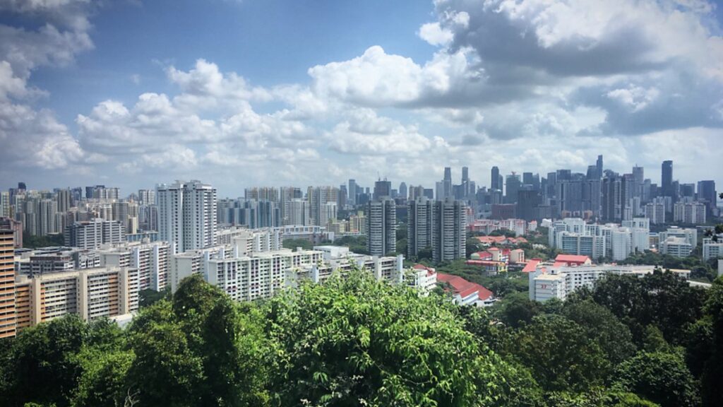 A modern city skyline surrounded by green landscape, illustrating the launch of the ALLJOBSGH employment platform in Ghana.